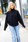 Lady In Black Ribbed Turtleneck Dolman Sweater